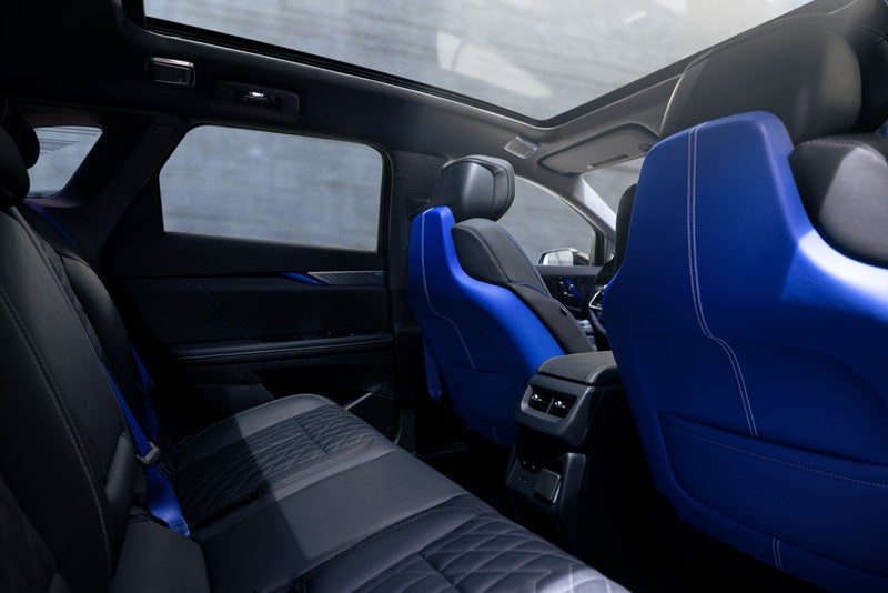 Back Seat View of the 2026 OPTIQ-V Blue Front Seats, Sun Roof, and Interior | Alfred Matthews Cadillac in Modesto CA